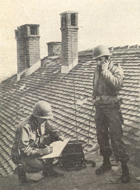 [Pfc Glenn Gore and Pfc George Uhl transmit firing data via radio]