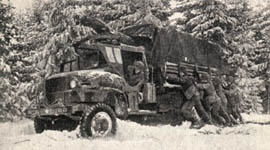 [78 Inf Div, GIs push truck]